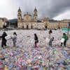 Colombian waste pickers inundate iconic Bogota square with plastic bottles to protest falling wages