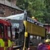 Fifteen hurt after double-decker bus hits bridge