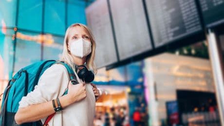 Holidaymakers told to wear masks and get jabs as cases of 'new Covid' soar