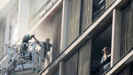 Firefighters rescue dozens from burning high rise in Santiago