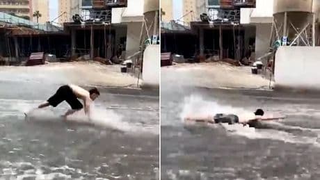 Moment man tries to swim through the streets of flooded Benidorm while cars are submerged in Italy as Europe is battered by freak storms with more to come