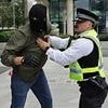 Peaceful pink-wearing mothers' migrants protest turns to violence: Masked men hijack demonstration, trying to rush gates at asylum seekers hotel before police crack down