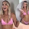 Vogue Williams sizzles in a skimpy pink bikini as she promotes her new tanning range after enjoying a family holiday in Spain