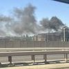 Moment inferno rips through shopping centre car park as huge plume of smoke spotted from miles around