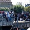 SUE REID: As Government promises to stop the boats, startling pictures of crowds queuing in France to catch traffickers' ride to Dover will startle and anger Britain