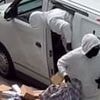 Moment brazen hazmat-suited thieves raid DPD van in suburban street before escaping in getaway car