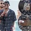 Marcus Rashford spotted with a mystery blonde on a lavish Saint-Tropez getaway, dressed in £210,000-worth of designer clothes and watches and carrying tobacco pouches as he waits for Man United transfer