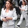 Coleen Rooney looks effortlessly chic in a grey blazer and trousers as she's spotted leaving hotel to visit husband Wayne ahead of Soccer Aid match