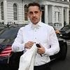 Gary Neville cuts a dapper figure in a white tuxedo as he leads the arrivals at pal David Beckham's star-studded 50th birthday bash at plush London venue