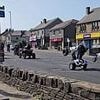 Moment balaclava-clad biker gang do wheelies as they terrorise locals on quiet road