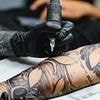 Iraqi asylum seeker wins right to stay in UK after claiming he couldn't go back to home country because his tattoos 'deviated from principles of Islam'