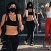 Kylie Jenner flashes toned torso at Pilates class with sister Kendall after shock admission about her boob job