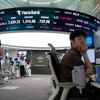 Asian shares mostly gain amid cautious relief over U.S.-China agreement