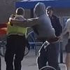 Moment feral yob attacks PCSO outside newsagents before have-a-go heroes intervene