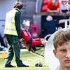 Footballer left bloodied and needing stitches after being hit by an object thrown by his OWN fans during pitch invasion in shocking scenes