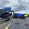 Major motorway is forced to a standstill after horror crash involving eight lorries and cars - as beer barrels spill across lanes