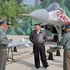 Kim Jong Un does Top Gun: North Korean leader puts pilots through their paces as he calls on his people to step up preparations for war