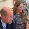 Royal brothers divided: William shares a heartwarming tale of home life with Prince Louis on anniversary of Queen's death...while solemn Harry visits her grave just miles away