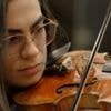 She travelled eight hours by bus for violin lessons. Now she's playing Wembley with Coldplay