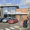 Man who crashed into McDonald's is arrested on suspicion of murder after dead woman in her 30s is later found in home