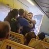Moment armed police drag drunken British stag do louts off Ryanair flight to Alicante