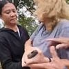 Man and woman are arrested on suspicion of racially aggravated assault after British NHS nurse 'attacked in park by couple who asked if she "came here on a rubber boat"'