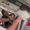Man-on-woman brawl erupts on American Airlines flight as passengers battled to disembark