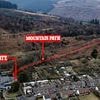 A gate too far! Couple who lost bitter war against neighbours over Bond-villain mansion finally remove illegal barrier after failing in their attempt to create a new access route