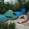 Gunfire at French migrant camp kills one and wounds five including a child as adult and 17-year-old arrested
