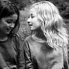 Can YOU spot the face? This photo of two girls has a third person hidden in it - so, can you see them?