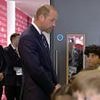 William's bitter-sweet moment: Prince greets players on the pitch at the FA Cup final... after his team Aston Villa were knocked out in the semi