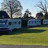 Boy, three, is seriously injured when hit by car towing caravan after travellers set up camp illegally on school playing field