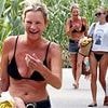 Kate Moss, 51, flaunts her incredible figure in a tiny black bikini as she guffaws during Ibiza beach trip with lookalike daughter Lila, 22