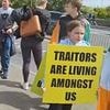 Ireland's asylum backlash: Huge crowds stage anti-migrant march as protesters blame Irish government for 'inviting the whole third world to come in' after 300% rise in asylum seekers
