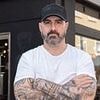 Can the Bitcoin Batman save Bedford? He's seen his hometown ravaged by shoplifting, drug abuse and homelessness. Now he's splashing his own cash to make the streets safe