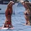 Dua Lipa showcases her impressive yoga moves on a paddle board in a TINY bikini during sun-soaked Ibiza getaway... as her shirtless fiancé Callum Turner gets in on the action!