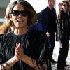 Halle Berry covers up in a dramatic sequinned tunic as she arrives for the Cannes Film Festival after organisers sensationally banned racy gowns from the ceremony