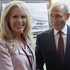 Trump's mystery woman plunged into Putin leak scandal as secret dossier is found in Alaska hotel