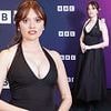 Aimee Lou Wood puts on a very busty display in a plunging black midi dress as she attends a BBC screening of the Film Club