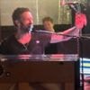 Chris Martin surprises fans with impromptu pub gig