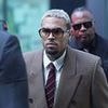 Chris Brown arrives at court as he faces trial for 'attacking victim with a bottle' in private Mayfair club