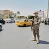 A warlord and 6 other people killed as militia infighting rocks Libya's capital, officials say