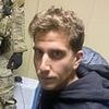 The moment he knew he'd been caught: Bryan Kohberger's stone-faced glare at arresting officer at his parents home
