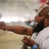Symbolism and smiles during the stoning of the devil ritual at the Hajj