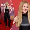 It's all about me! Nicole Kidman steals the spotlight at the Country Music Awards as husband Keith Urban stands in the background - despite being up for the Triple Crown Award