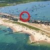 Drunken sailors will destroy our seaside idyll: Owners of Britain's most expensive beach huts fears 'rabble of partygoers' using new floating restaurant will ruin their peace and quiet