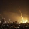 Explosions and huge plumes of smoke in Tel Aviv as Iran retaliates