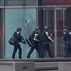 Mass shooter with assault rifle kills four people, including police officer, in terrifying midtown NYC rampage