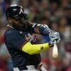 Ozuna's sacrifice fly in 10th gives Braves 12-11 win over Reds