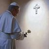 Pope Leo XIV lays a white rose on the tomb of the late Pope Francis as he pays touching tribute to his predecessor